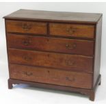 A George III oak chest of two short & three graduated long drawers on bracket supports, 120cm wide