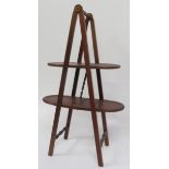 An early 20th Century mahogany folding cake stand