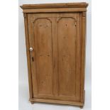 A Victorian stripped pine single wardrobe with single panelled door 177cm high 105cm wide