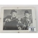 WITHDRAWN Autographs - Laurel & Hardy; a black & white printed portrait of the duo with ink