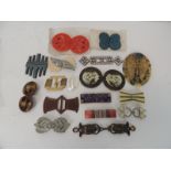 An interesting collection of ladies decorative dress belt clasps includes two plastic on original