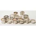 Twelve assorted napkin rings, some silver, total silver weight 5ozt