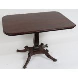 A 19th Century mahogany rectangular tilt top table on vase shaped pillar and four splayed supports