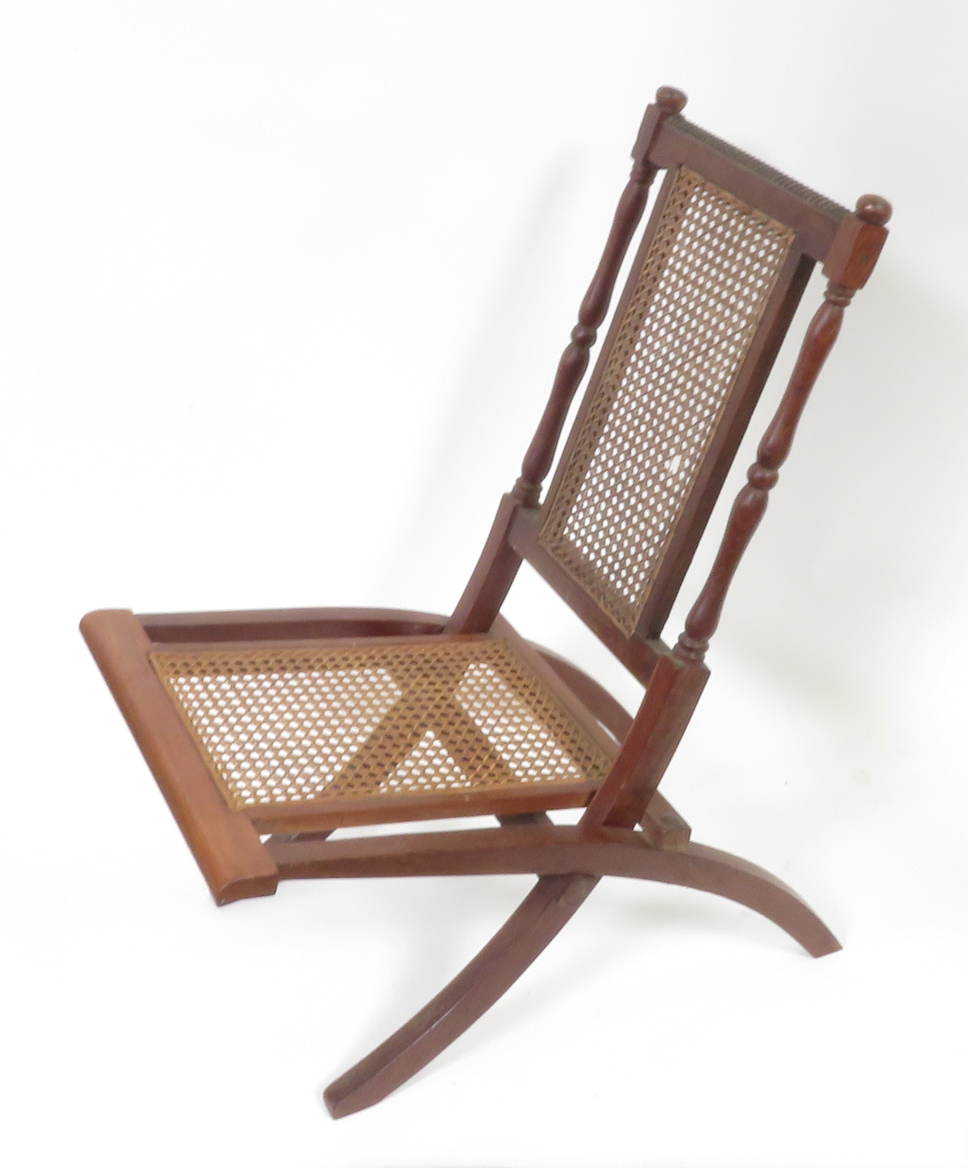 An Edwardian mahogany & woven cane folding chair