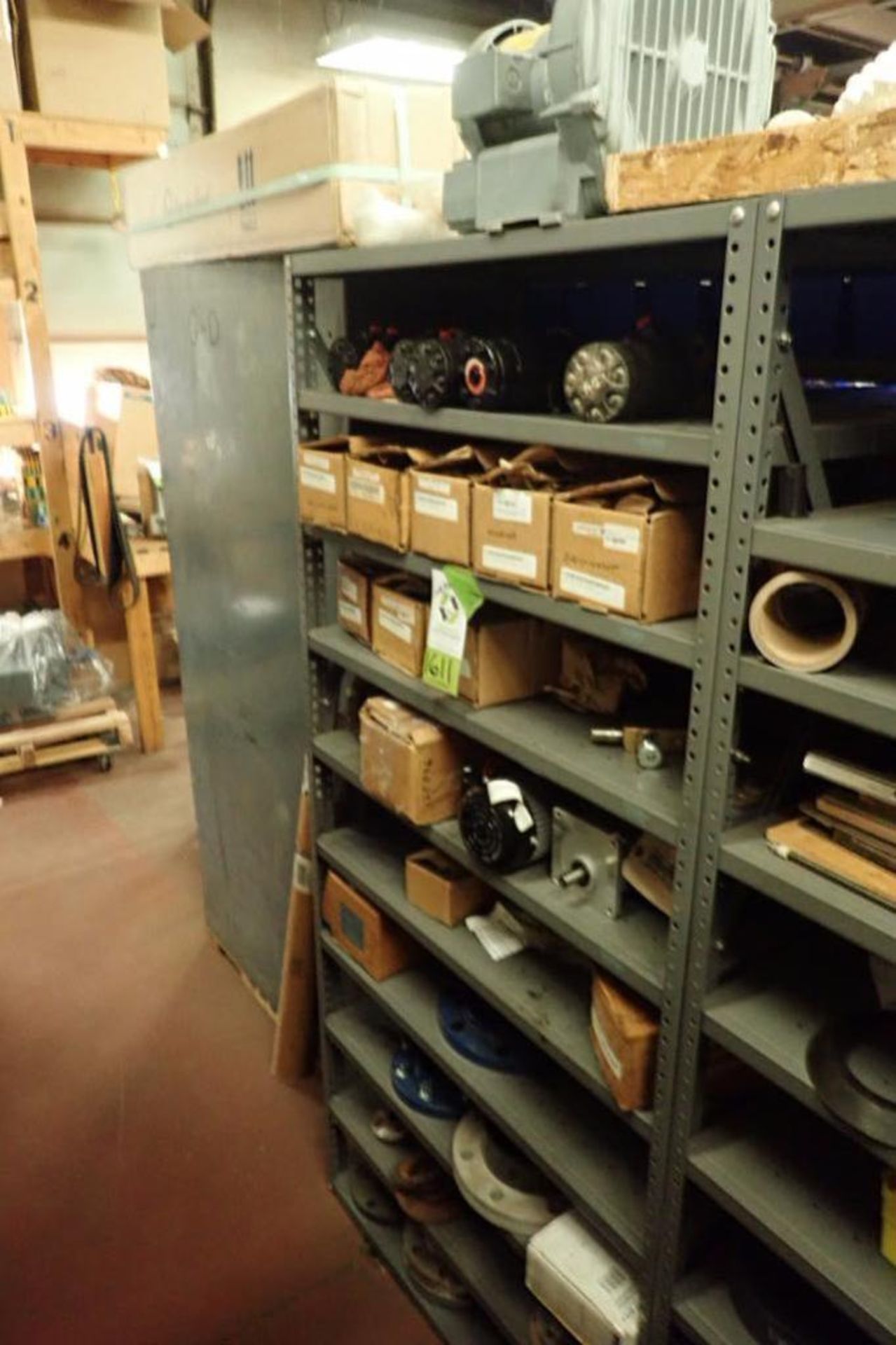 Contents only of 1 section of shelving, hydraulic motors, electric motors, water pipe flanges ** Rig