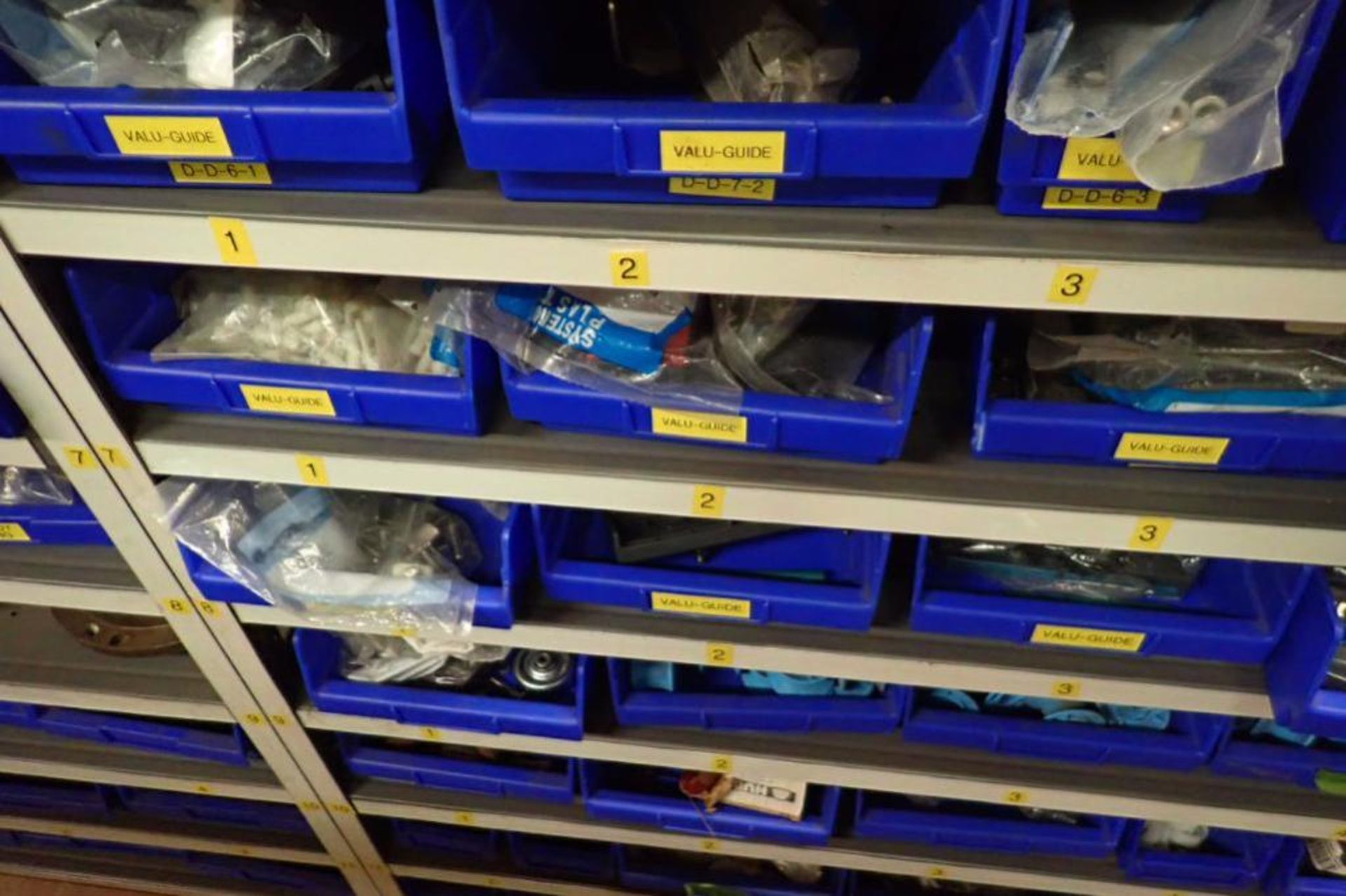 Contents only of 3 sections of shelving, conveyor parts, roller, clamps, springs, rod ends, hydrauli - Image 10 of 22