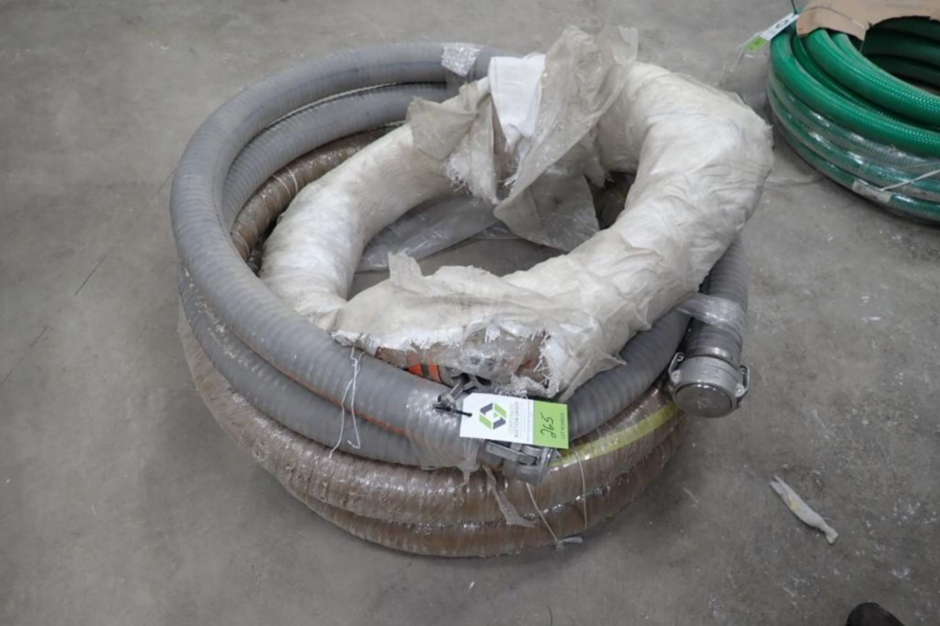 4 in. flexible food grade hose, camlock fittings. **Rigging Fee: $50** (Located in Brooklyn Park, MN