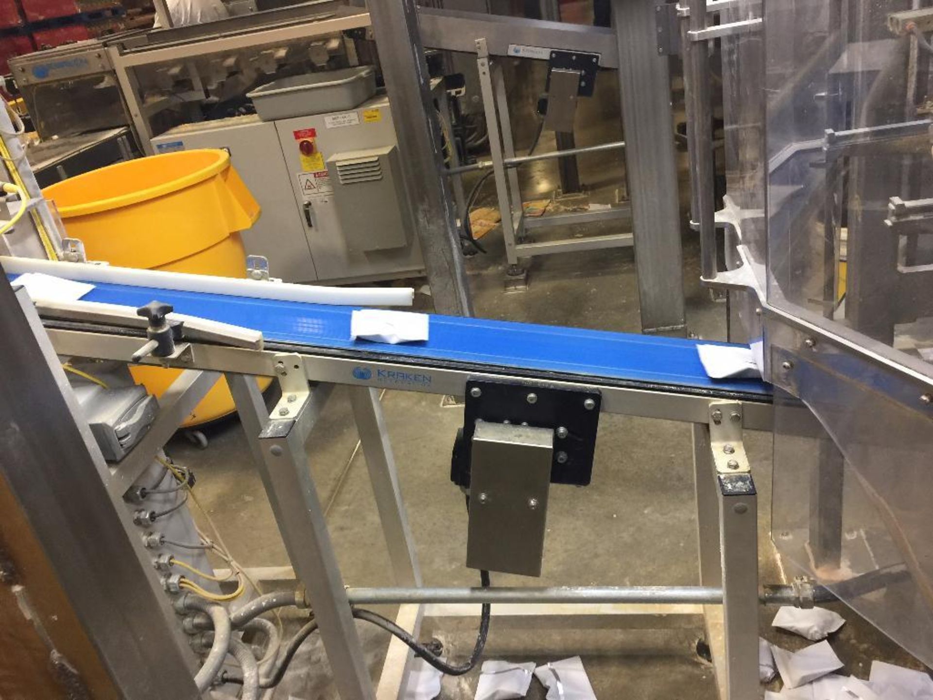 Kraken conveyor, 79 in. x 6 in. incline out of filler, blue belt, motor and drive. **Rigging Fee: $2 - Image 2 of 4