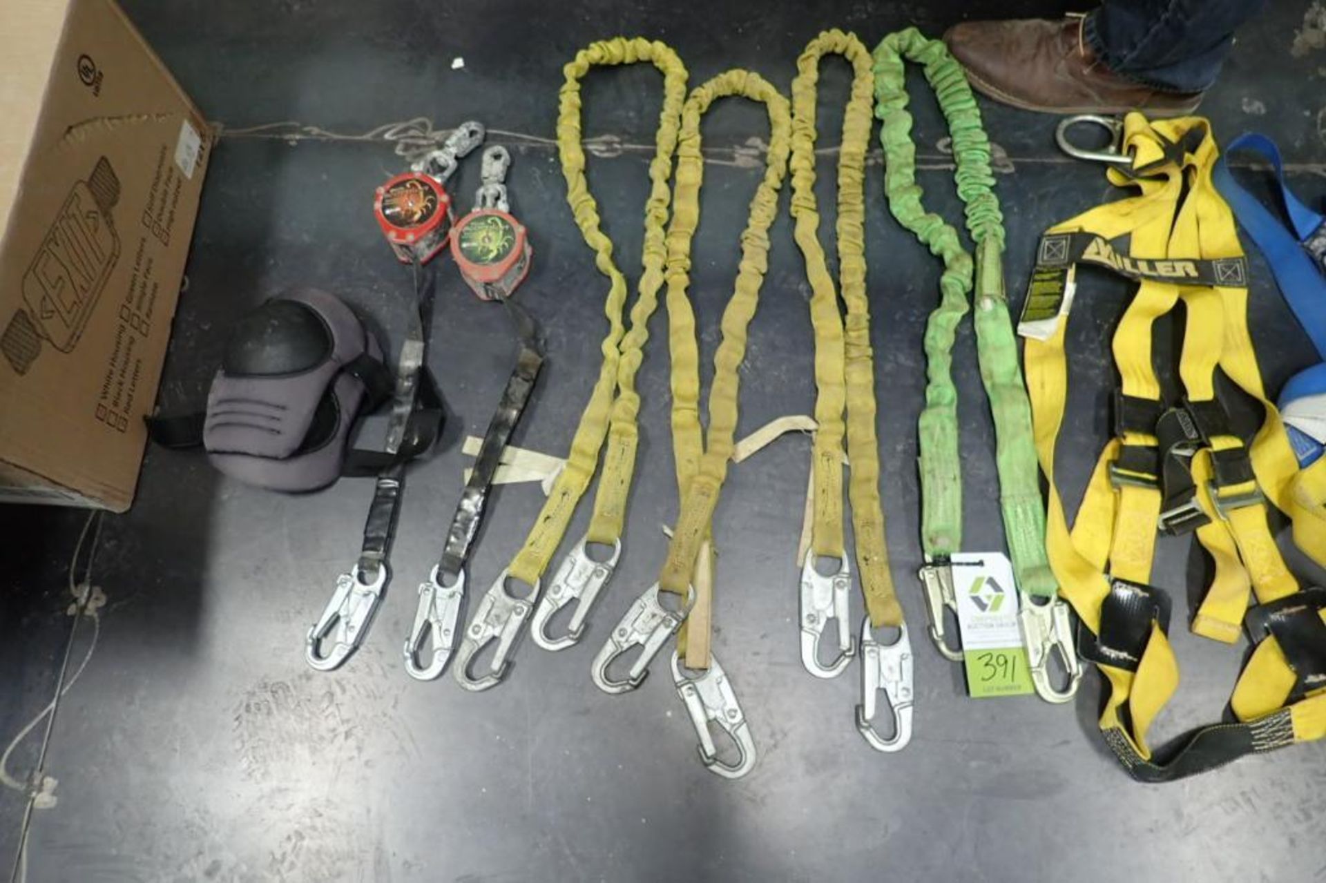 Assorted fall protection, harnesses, lanyards, retractable lanyards. **Rigging Fee: $15** (Located i - Image 3 of 4