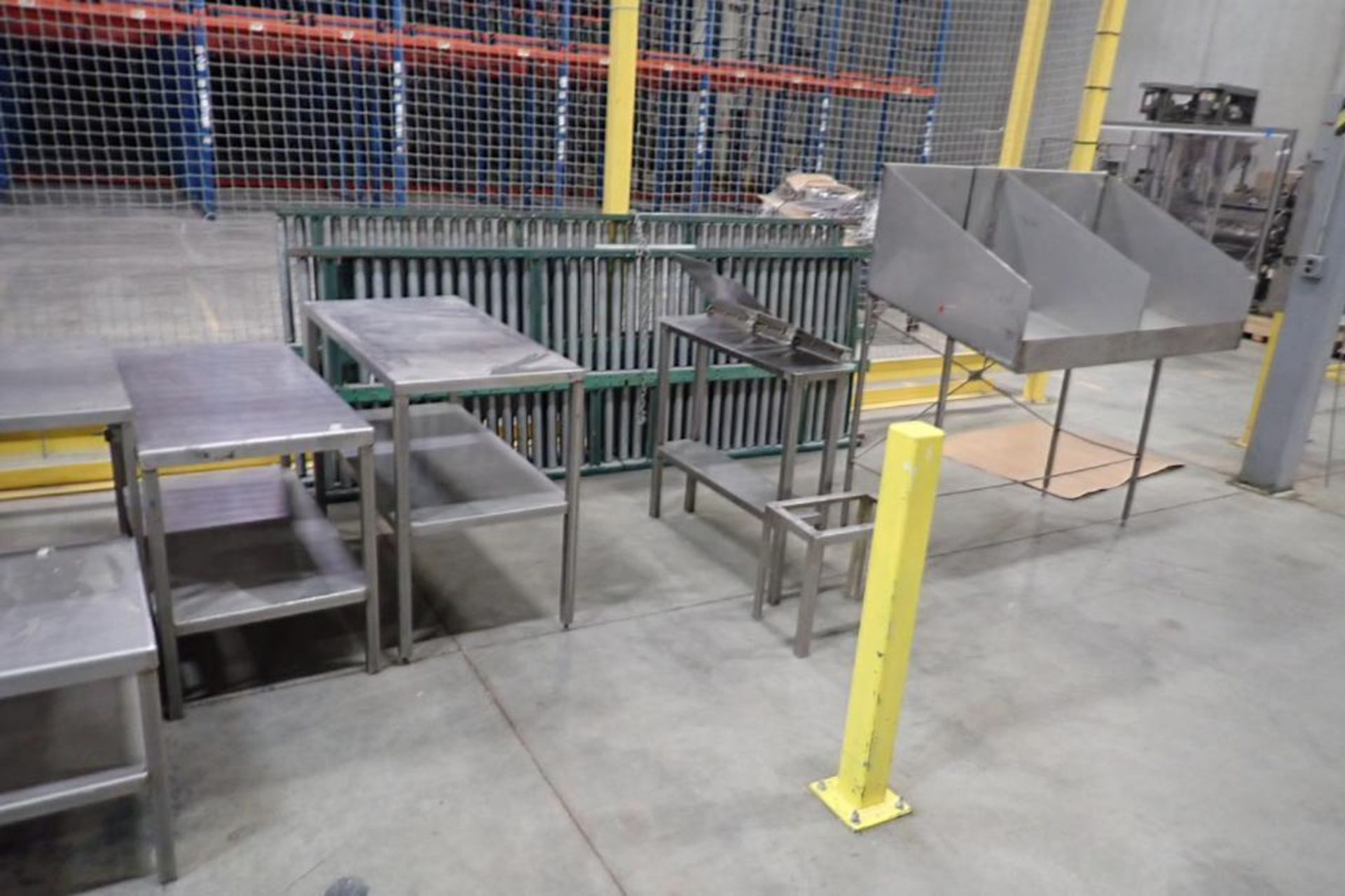 (9) assorted SS tables and production stands. **Rigging Fee: $200** (Located in Brooklyn Park, MN.)