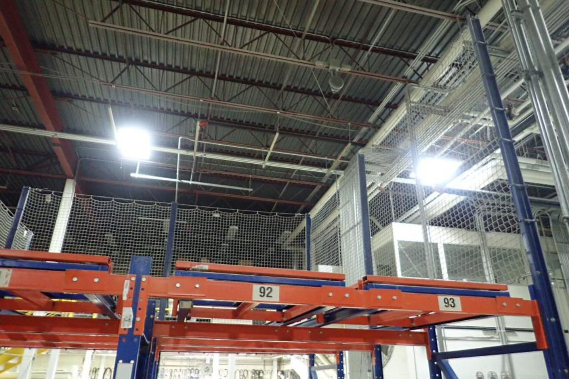 (2) bays push back rack, 4 deep, 112 in. tall, 32 pallet positions, with safety nets. **Rigging Fee: - Image 4 of 4