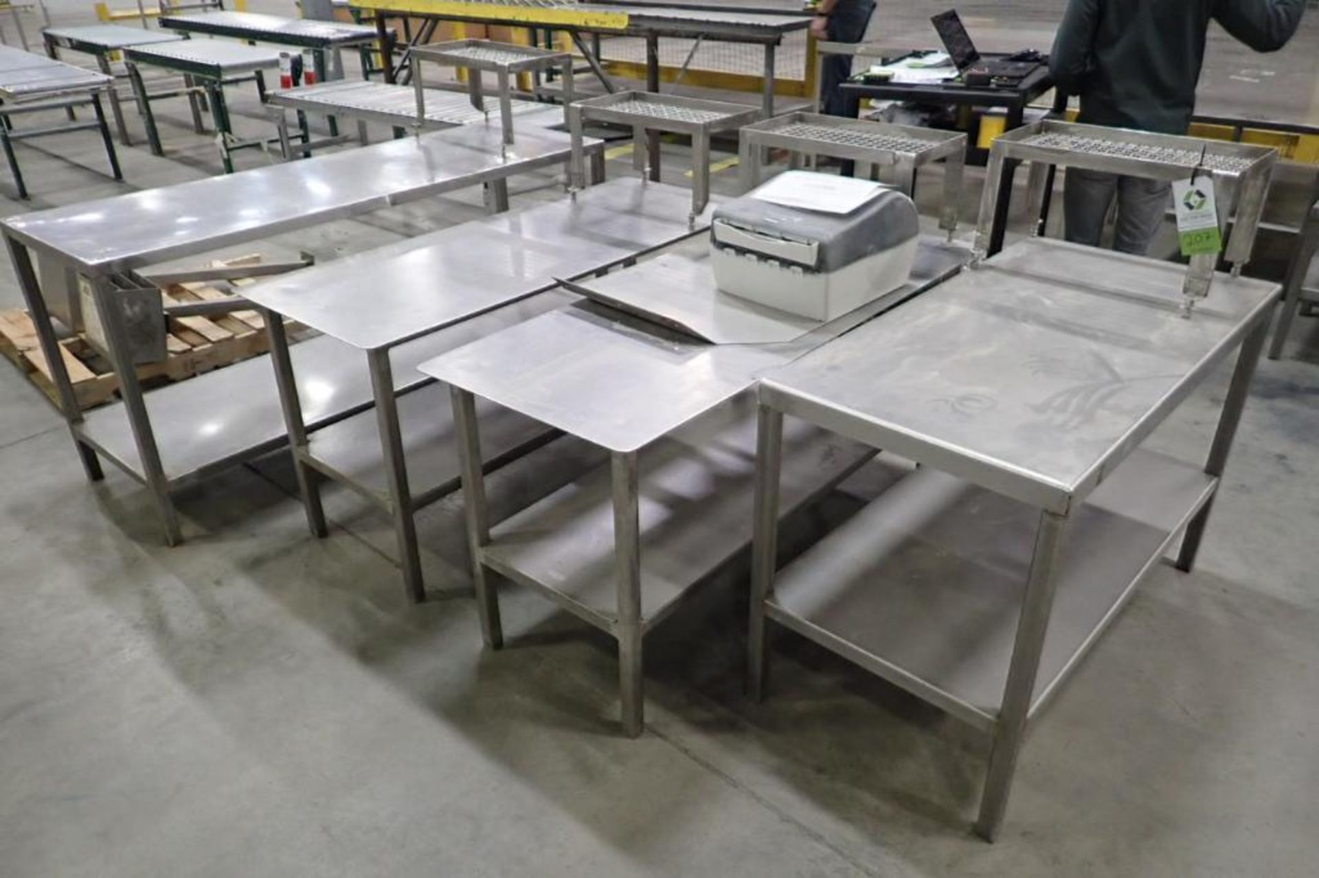 (4) SS assorted tables and (2) pedestal stands. **Rigging Fee: $100** (Located in Brooklyn Park, MN.