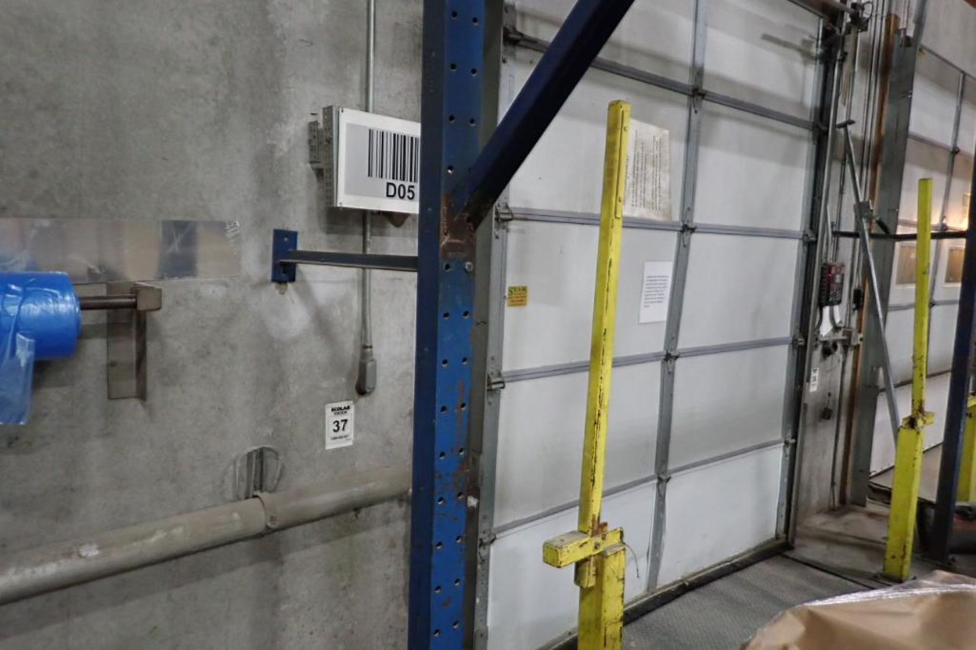 (2) bays wall mount pallet rack above shipping doors, 12 ft. wide, 16 ft. tall.. **Rigging Fee: $250 - Image 3 of 4