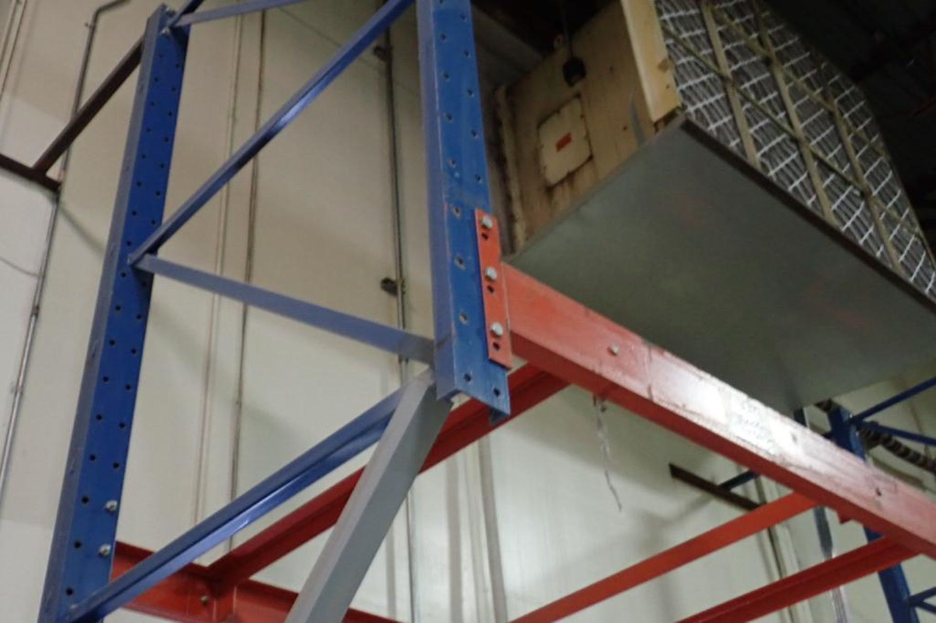 (6) bays wall mount pallet rack above shipping doors, 12 ft. wide, 16 ft. tall.. **Rigging Fee: $300 - Image 2 of 3