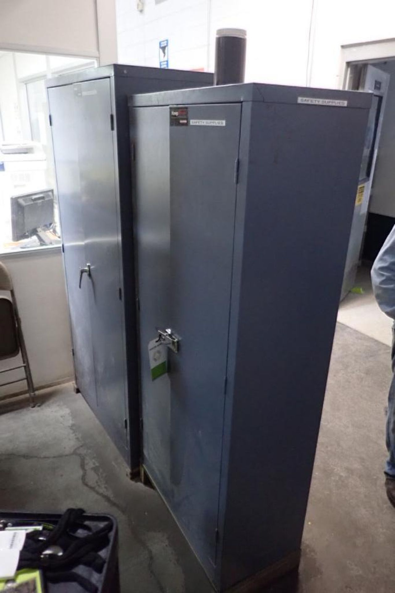 (2) mild steel cabinets and contents, assorted safety supplies. **Rigging Fee: $175** (Located in Br