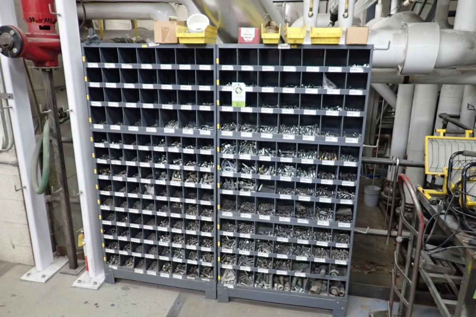 168 hole pigeon hole cabinets with contents, assorted bolts and nuts. **Rigging Fee: $150** (Located