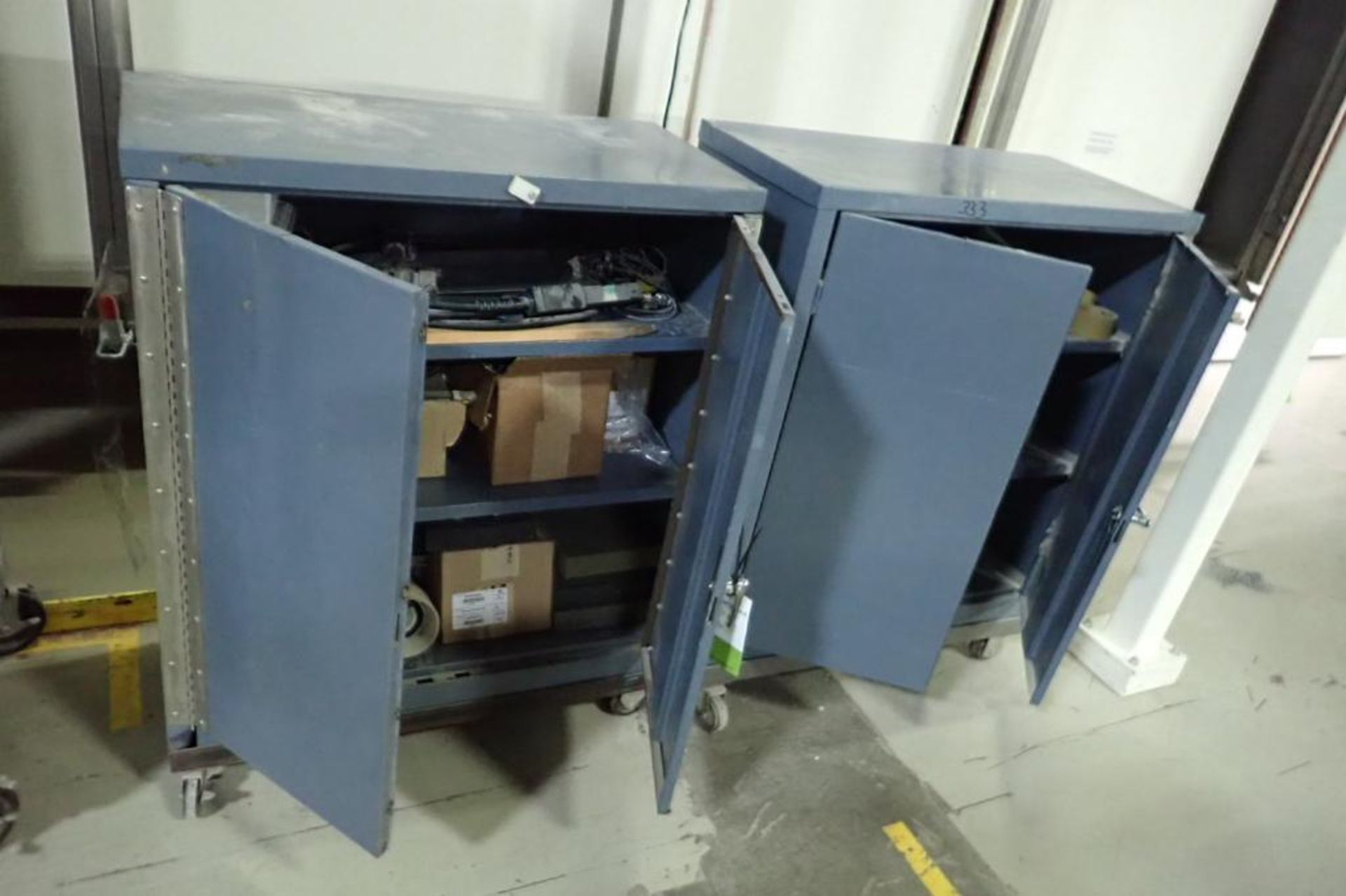 (2) cabinets and contents, ink jet parts, adjustable height stand parts. **Rigging Fee: $175** (Loca