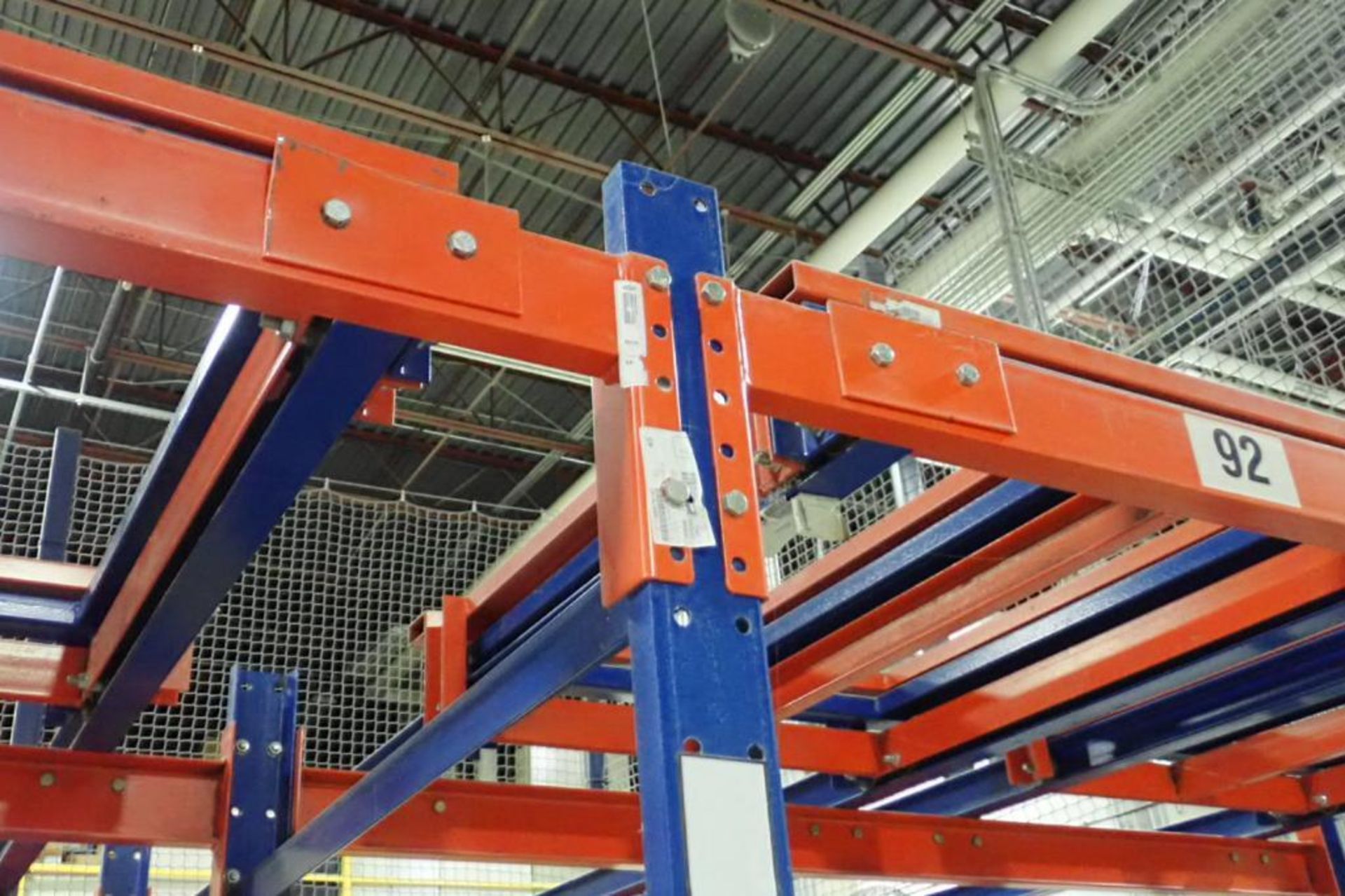 (2) bays push back rack, 4 deep, 112 in. tall, 32 pallet positions, with safety nets. **Rigging Fee: - Image 3 of 4