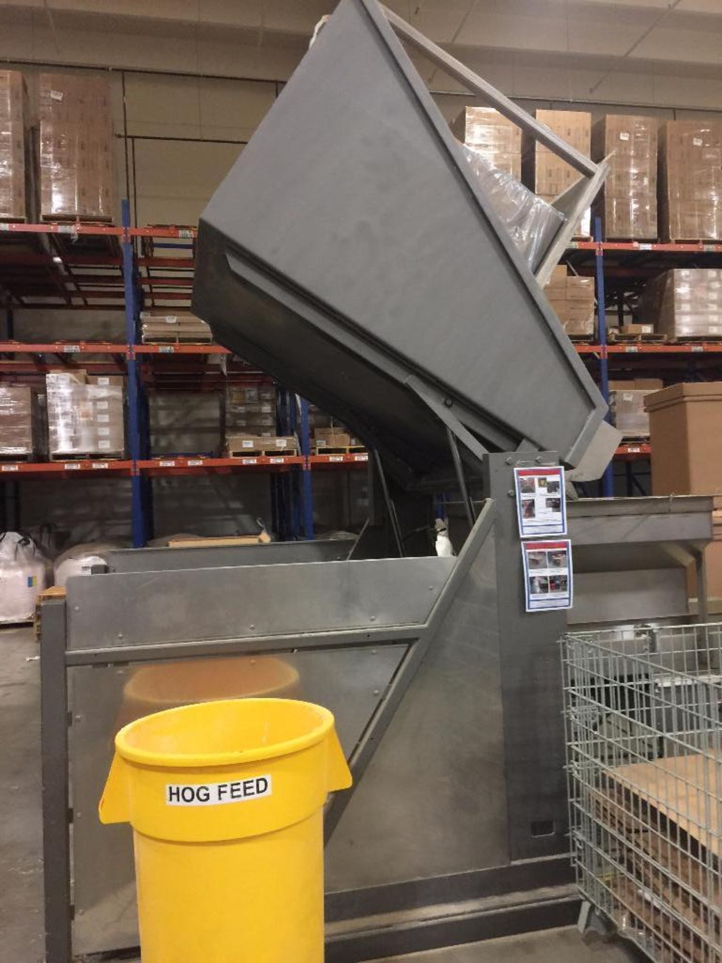 SS tote dump, 68 in. pivot height, motor and hydraulic pump. **Rigging Fee: $250 ** (Located in Keno