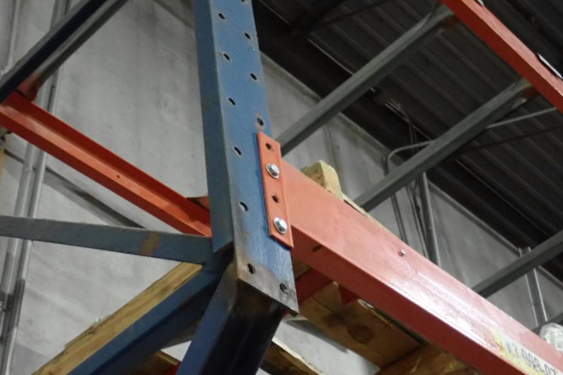 (2) bays wall mount pallet rack above shipping doors, 12 ft. wide, 16 ft. tall.. **Rigging Fee: $250 - Image 4 of 4