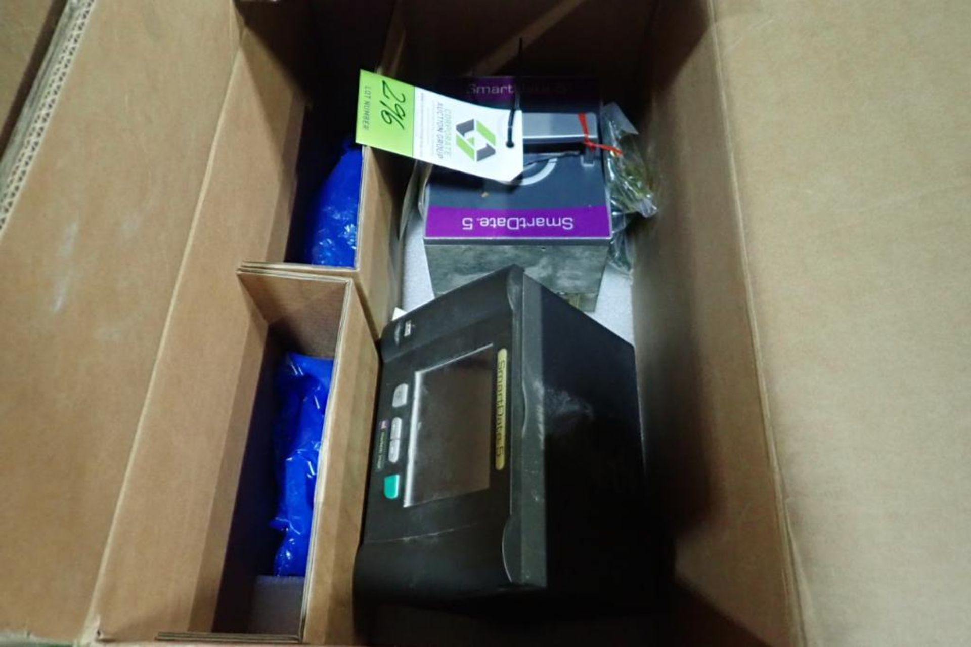 (2) boxes of Markem smart date coders parts. **Rigging Fee: $25** (Located in Brooklyn Park, MN.)