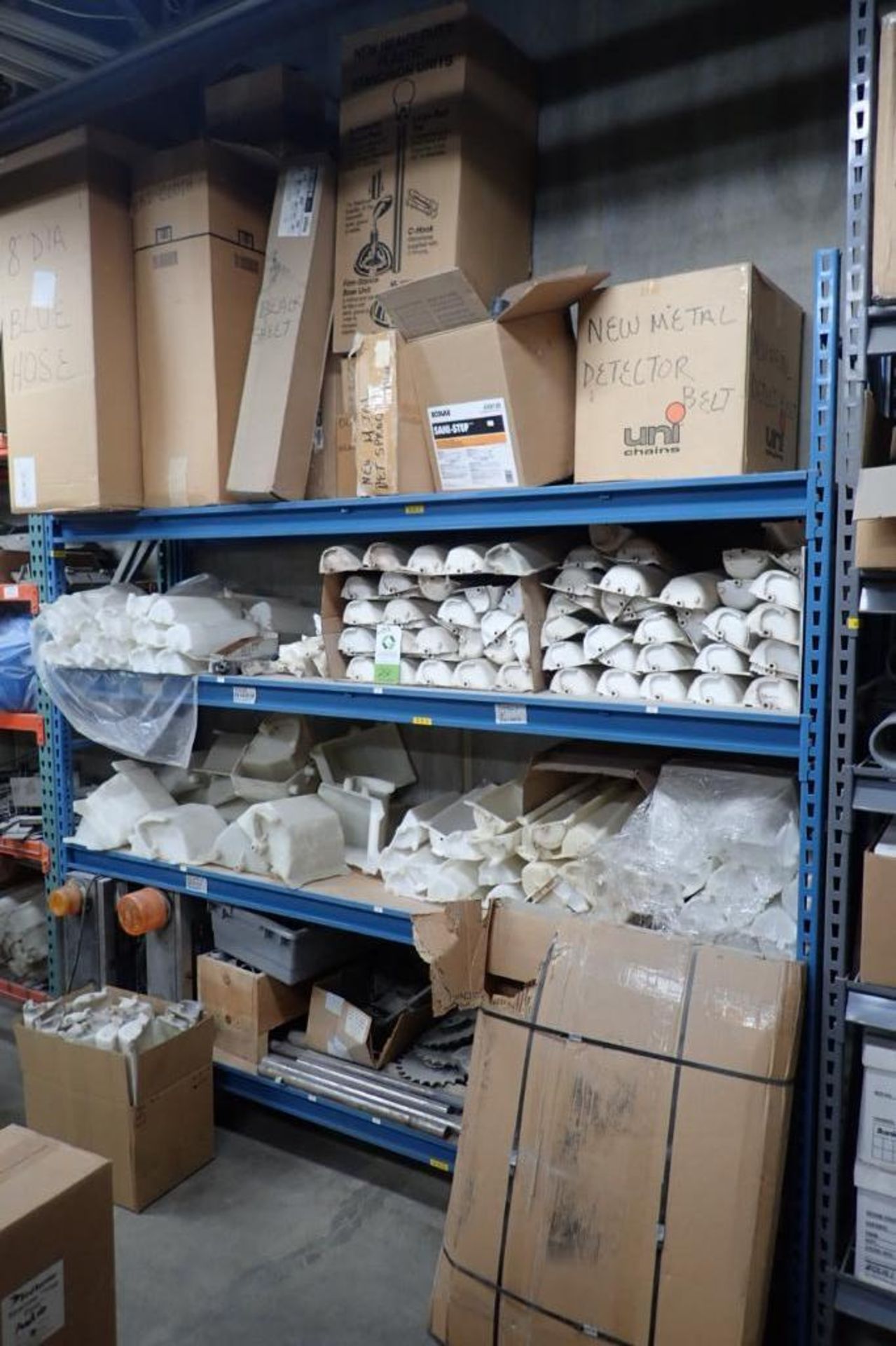 Contents of 8 ft. of shelves, elevator buckets, ink jet parts, conveyor shafts and gears. **Rigging