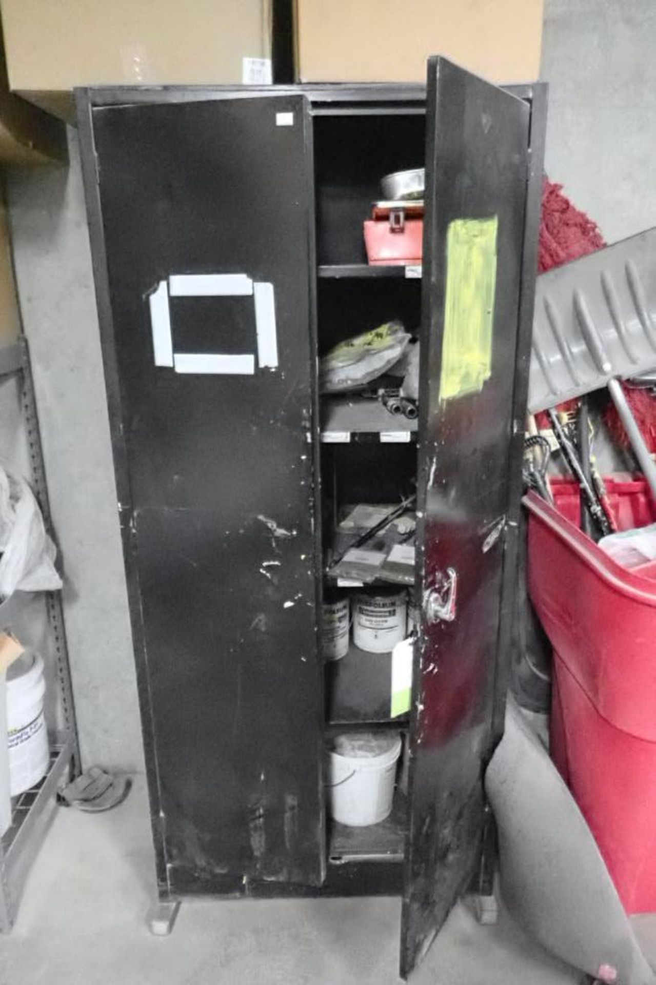 2-door cabinet with contents, paint supplies, brushes, rollers, paint pans. **Rigging Fee: $100** (L