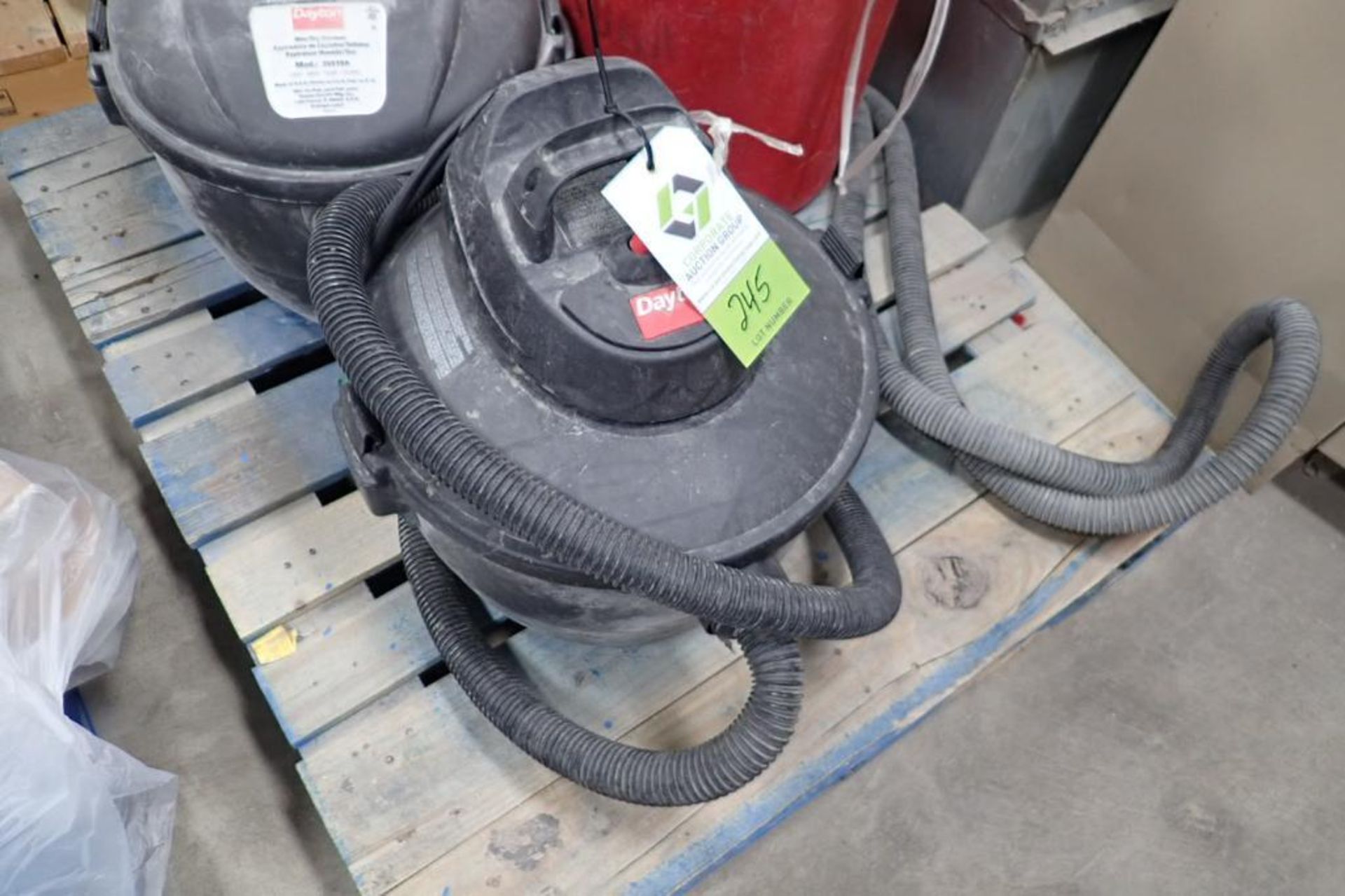 (2) Dayton wet/dry vacuums, assorted attachments. **Rigging Fee: $25** (Located in Brooklyn Park, MN - Image 4 of 5