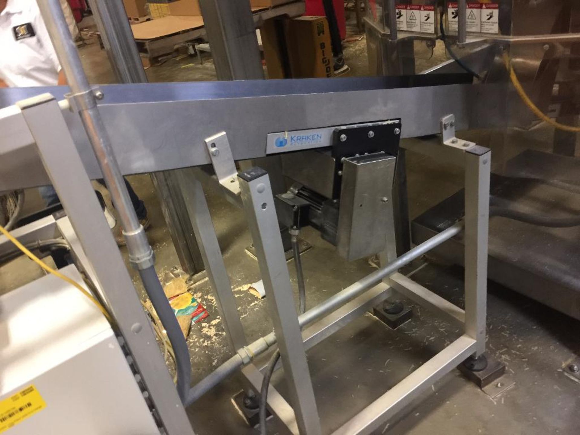 Kraken conveyor, 79 in. x 6 in. incline out of filler, blue belt, motor and drive. **Rigging Fee: $2 - Image 2 of 4