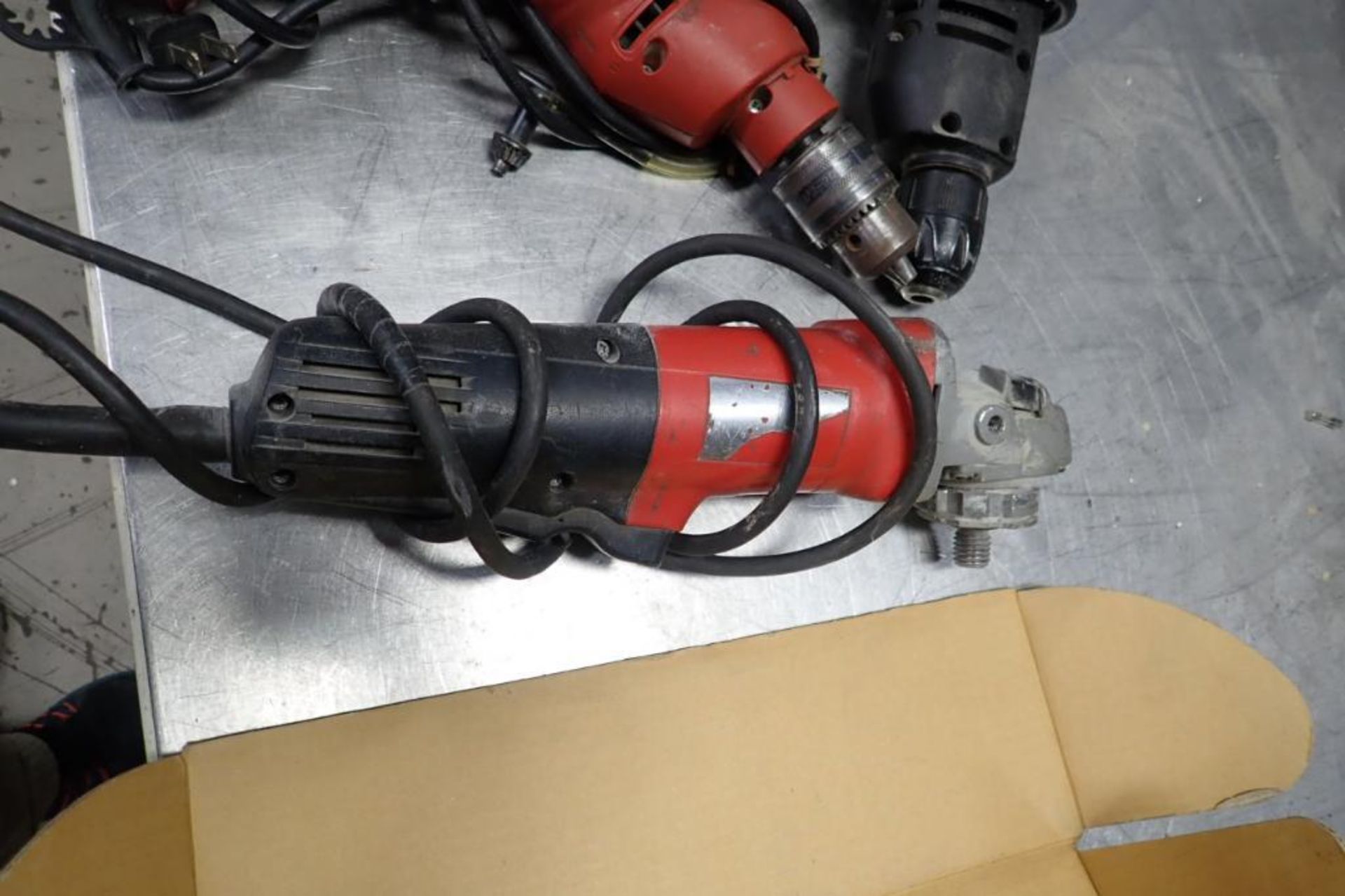 Milwaukee right angle grinder, (2) electric drills. **Rigging Fee: $10** (Located in Brooklyn Park, - Image 2 of 5