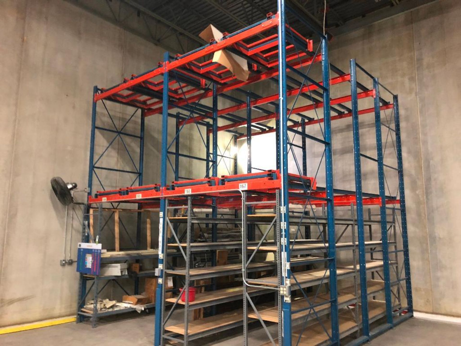 Push back rack, (2) bays, 4 positions deep, 17 ft. tall, 32 pallet positions.. **Rigging Fee: $400**