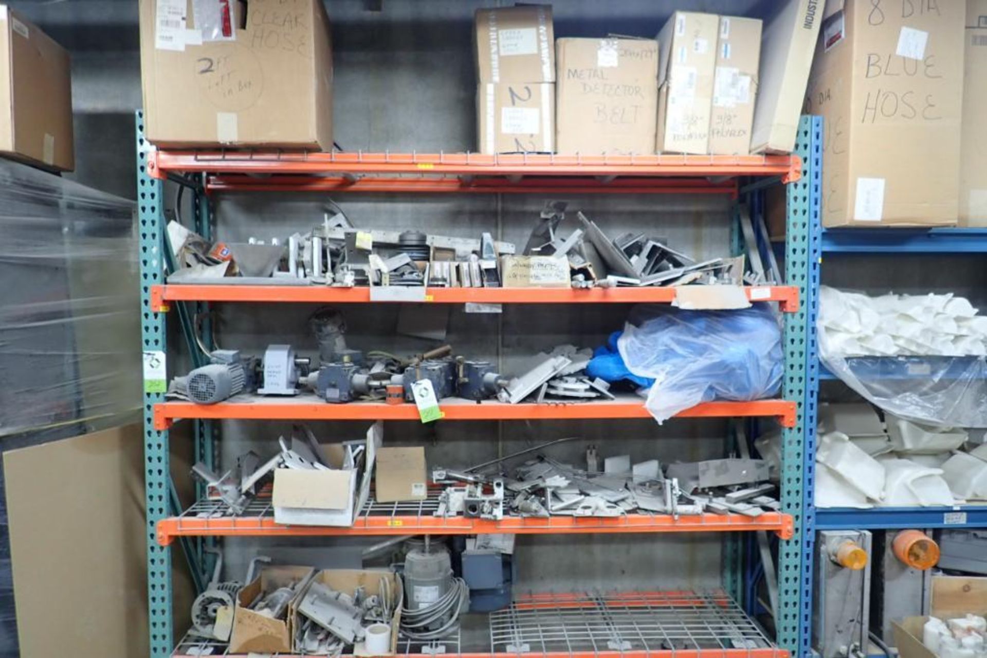 Contents of 8 ft. of shelves, motors, speed reducers, gearboxes, conveyor belts. **Rigging Fee: $275