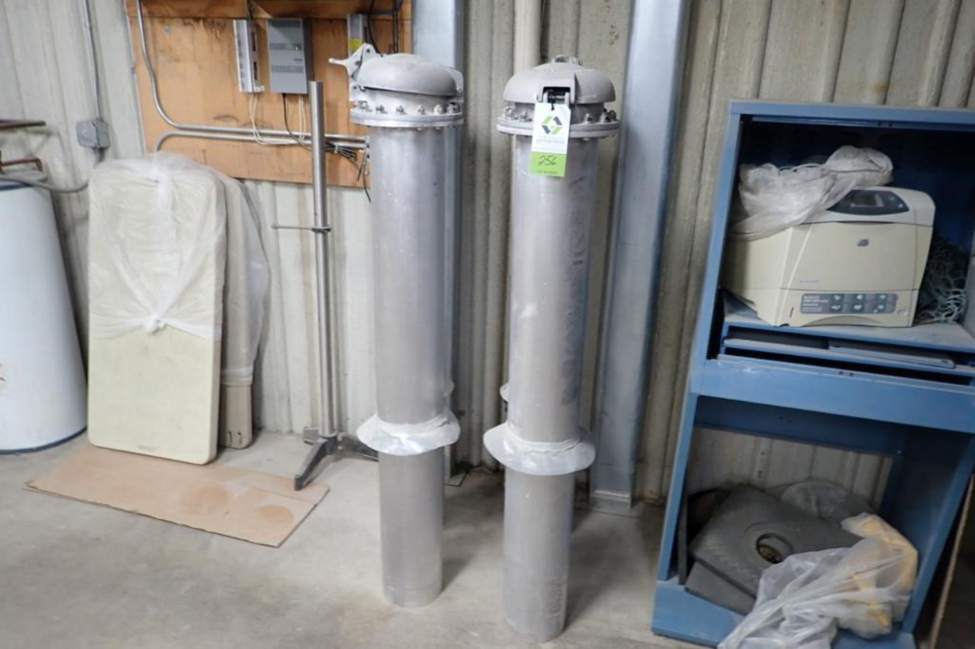 (4) aluminum pressure tubes with caps. **Rigging Fee: $100** (Located in Brooklyn Park, MN.)