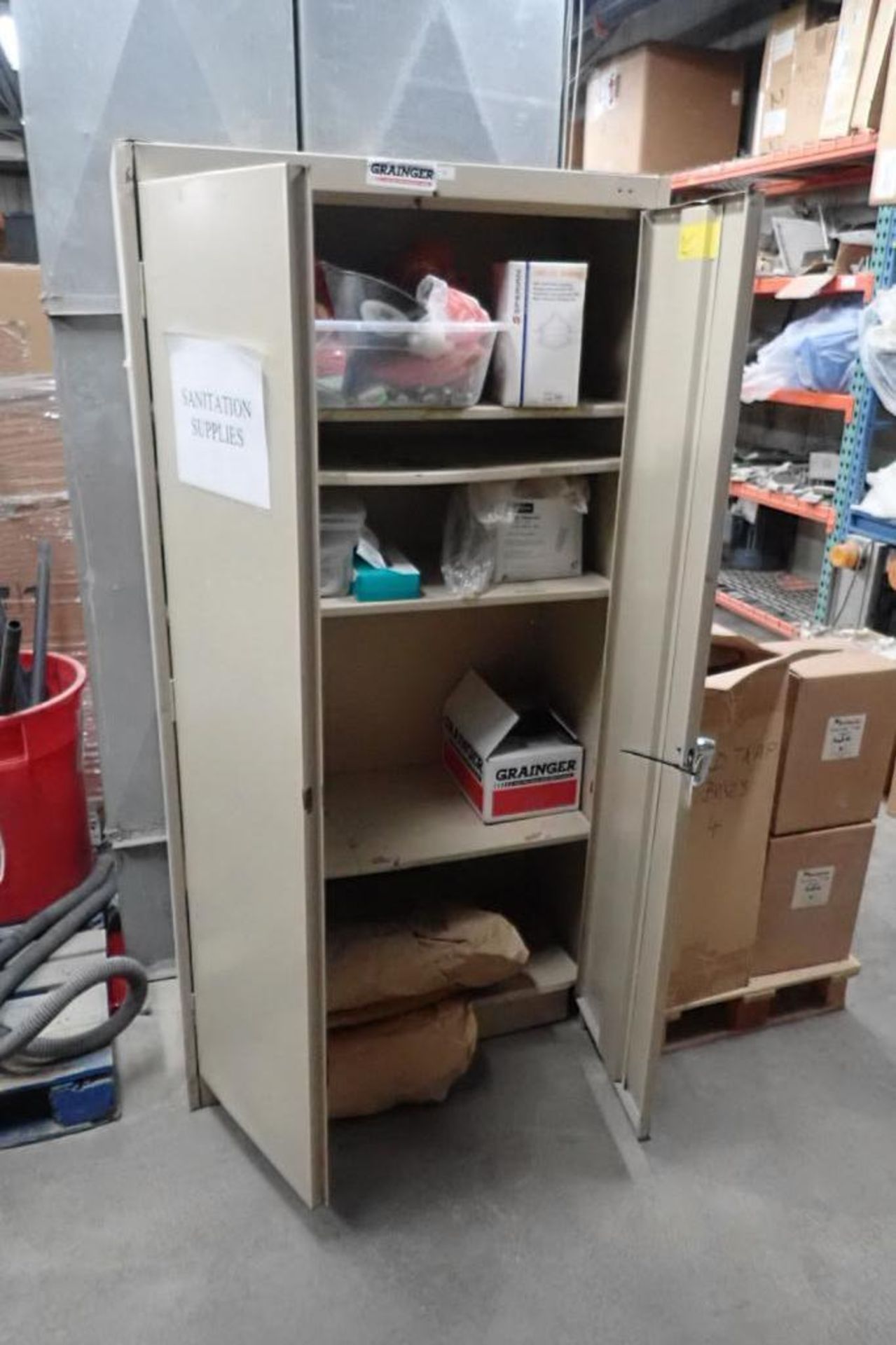 2-door cabinet with contents, respirators, mop heads, funnels, poly sleeves, wire mesh trays. **Rigg