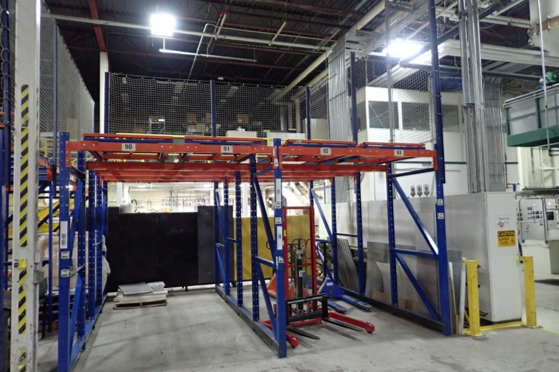 (2) bays push back rack, 4 deep, 112 in. tall, 32 pallet positions, with safety nets. **Rigging Fee: