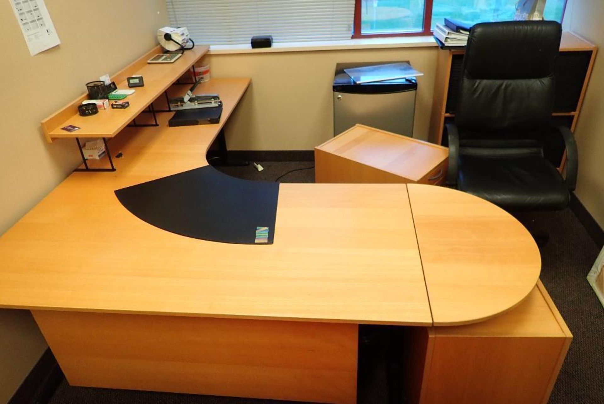 Contents of office, oval table, desk, mini fridge, chair. **Rigging Fee: $150** (Located in Delta, B - Image 2 of 4