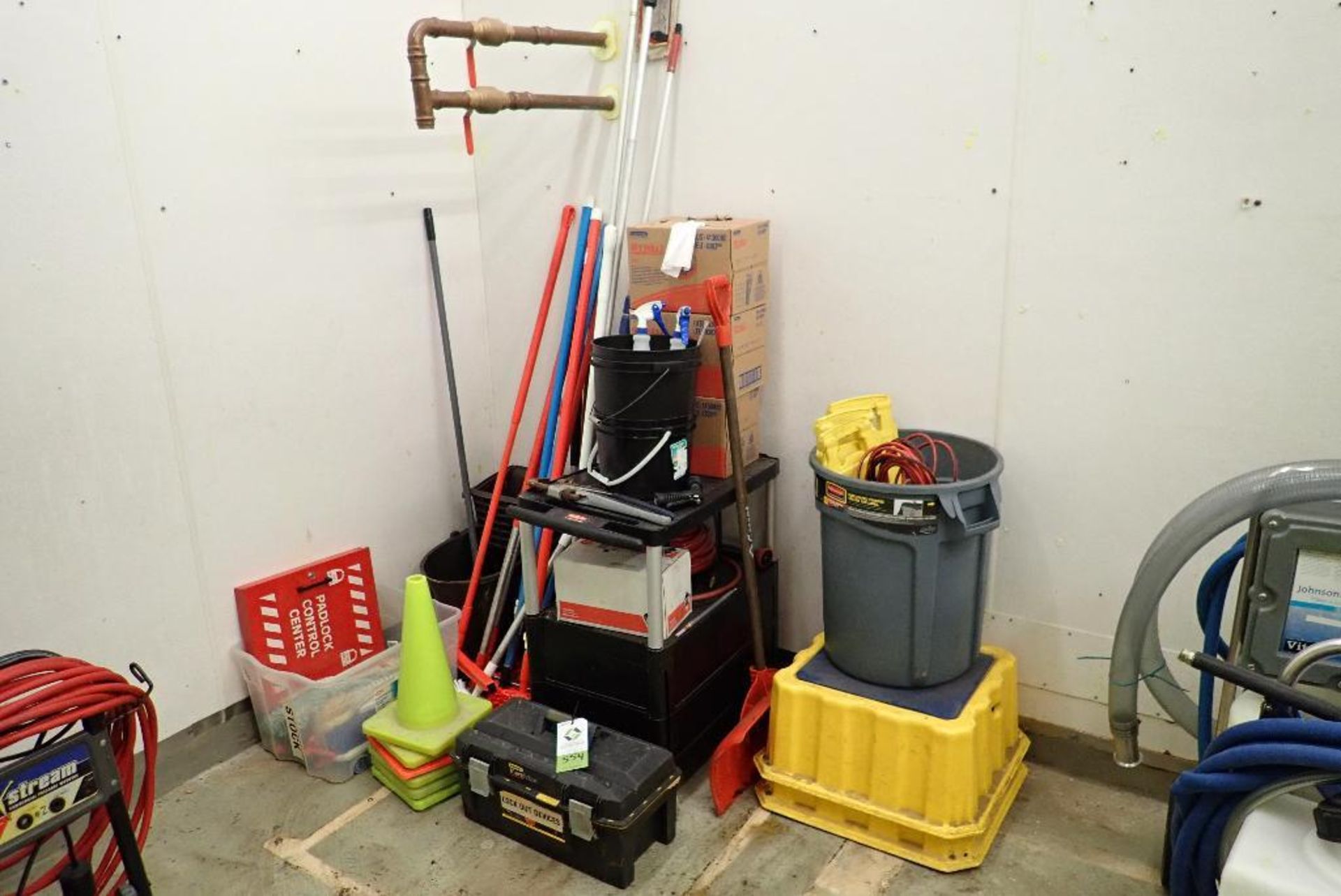 Lot of assorted sanitation supplies, brushes, brooms, mops, signs, safety cones. **Rigging Fee: $50*