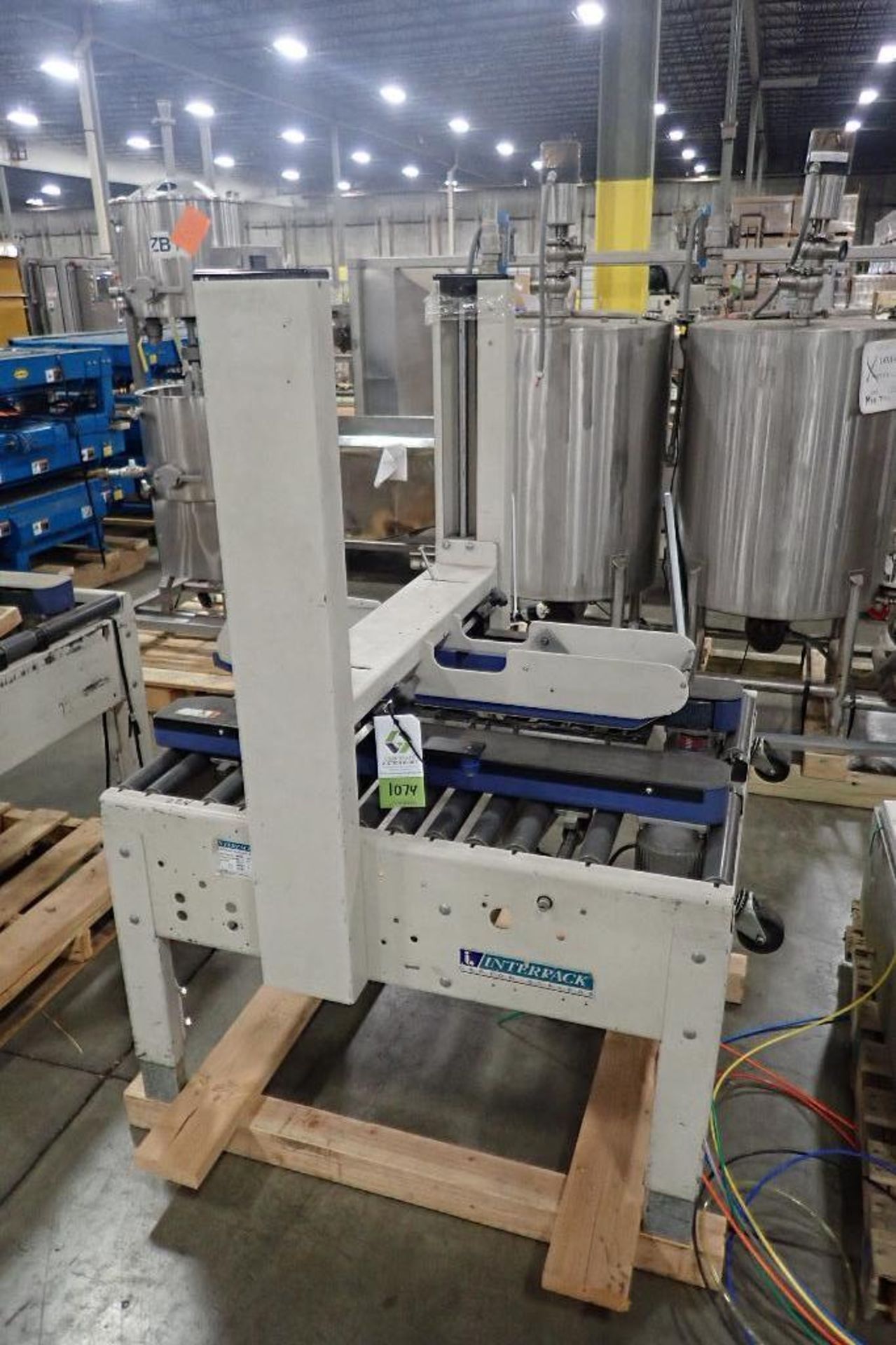 Interpack adjustable case sealer, Model USA2024SB, missing heads. **Rigging Fee: $50** (Located in 3