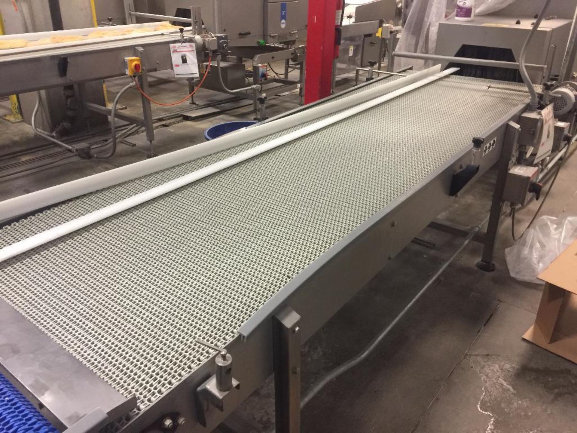 SS conveyor, 120 in. x 36 in., white plastic chain, motor and drive.. **Rigging Fee: $150** (Located
