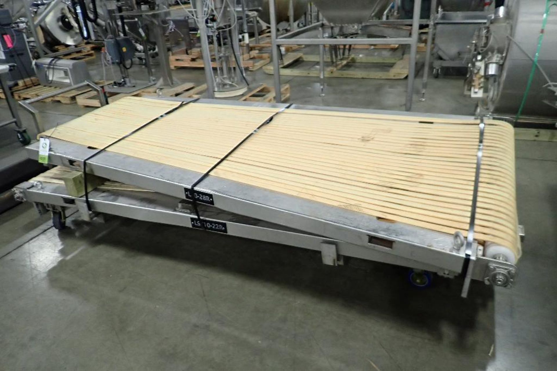 (2) spreader belt conveyor tops, 22 row and 28 row, 1 1/4 in. wide belts, SS frames. **Rigging Fee: