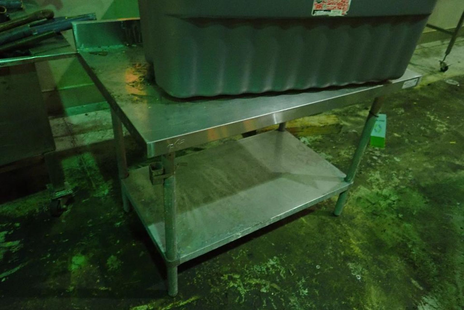 SS table with backsplash, 48 in. long x 29 in. wide x 34 in. tall. **Rigging Fee: $50** (Located in - Image 3 of 3