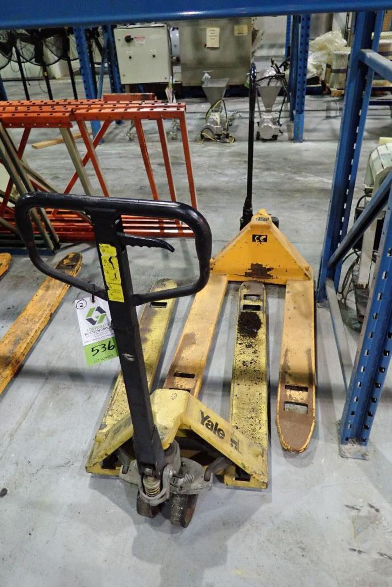 (2) hand pallet jacks, not working, one is missing pin in rear whel. **Rigging Fee: $15** (Located i