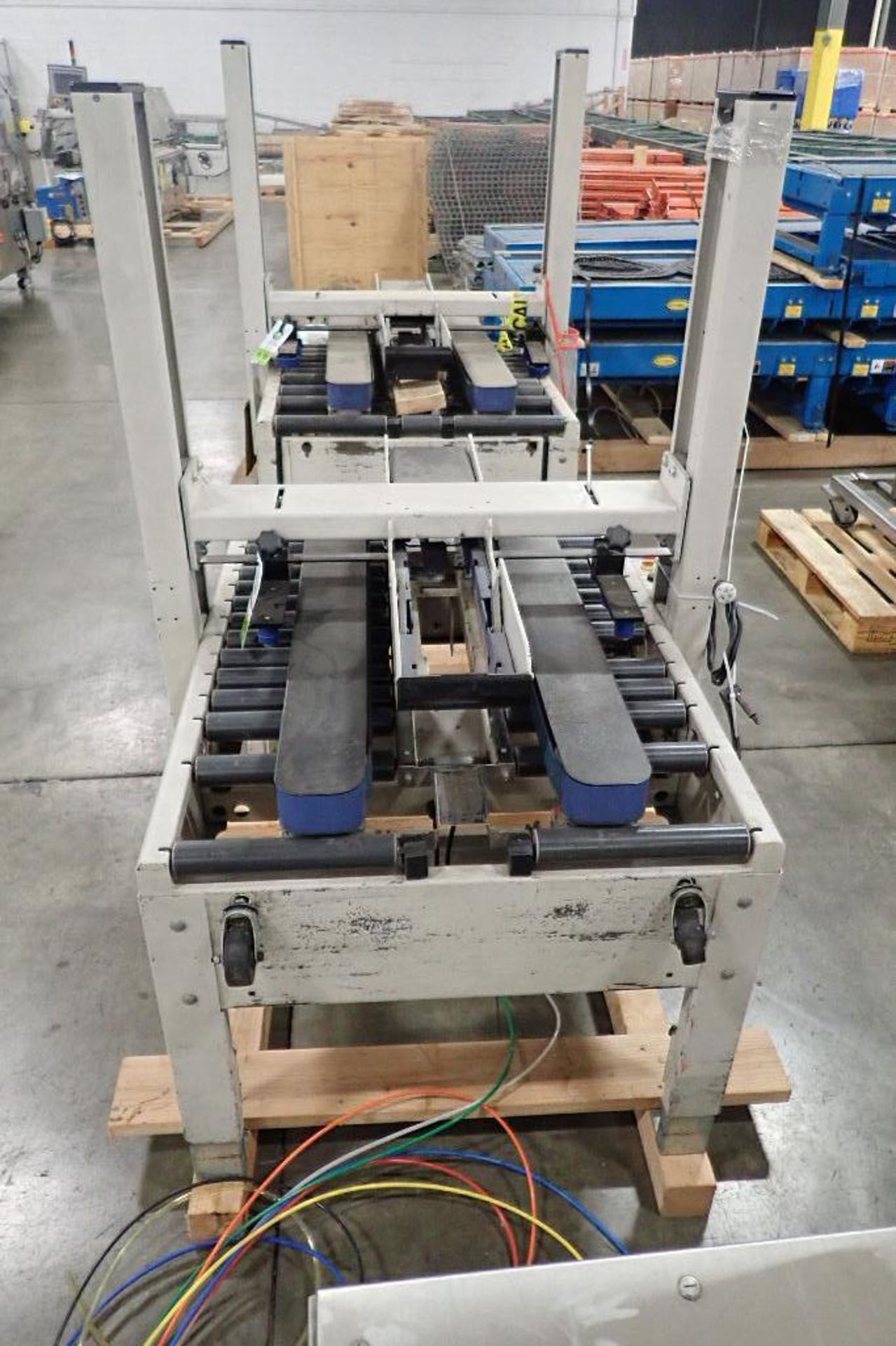 Interpack adjustable case sealer, Model USA2024SB, missing heads. **Rigging Fee: $50** (Located in 3 - Image 2 of 8
