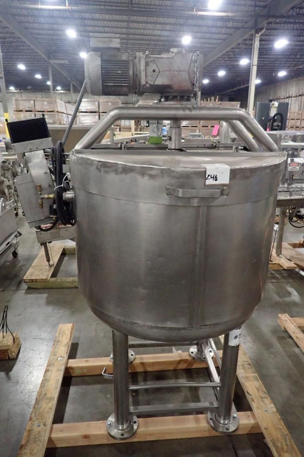 SS jacketed mix tank, 36 in. dia x 32 in. tall, dented jacket, exposed jacket where control panel wa