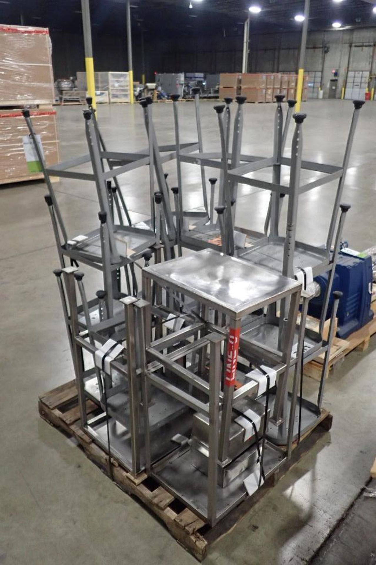 Skid SS tables and stools. (See photos for additional specs). **Rigging Fee: $50** (Located in Eagan