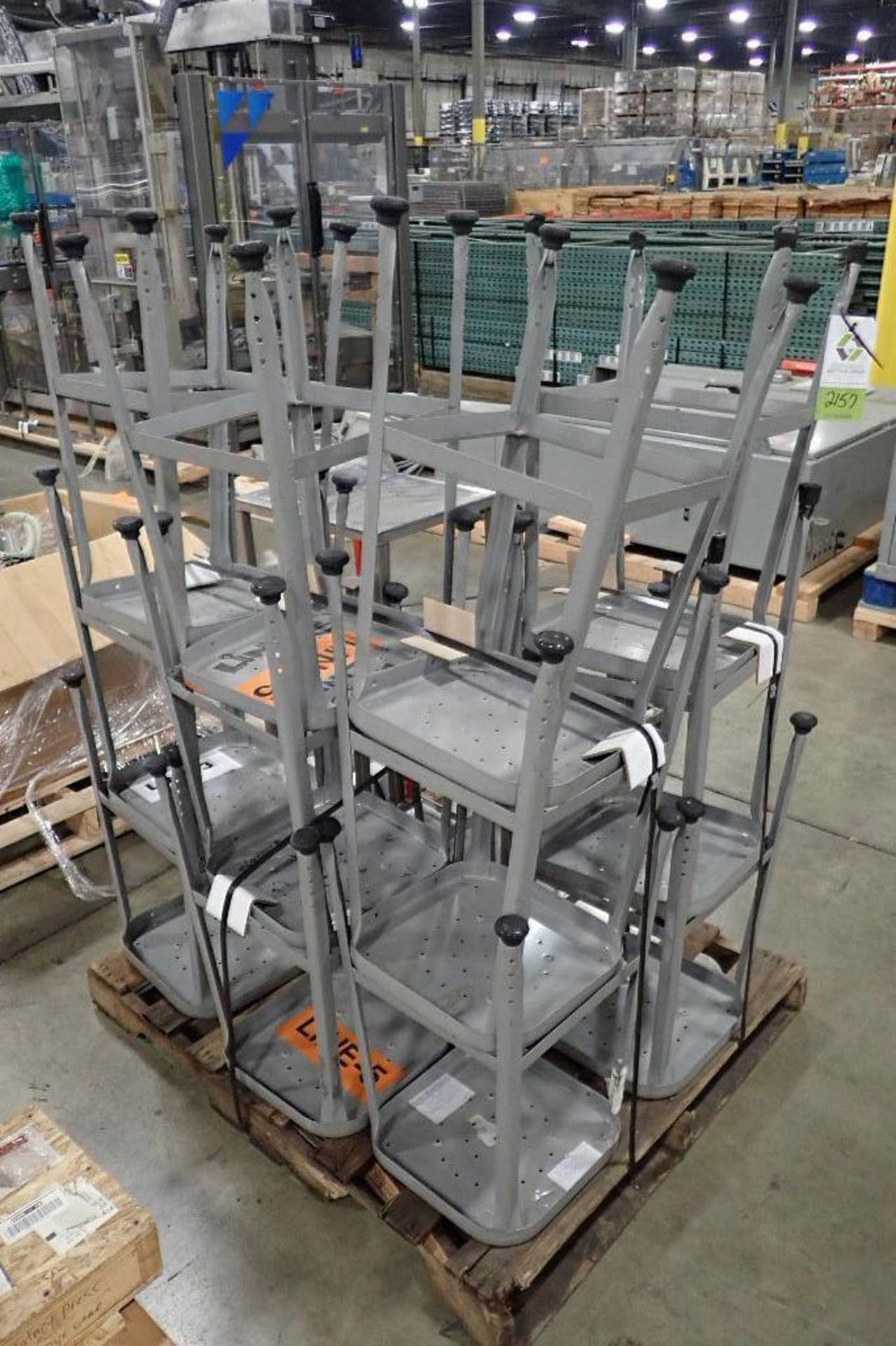 Skid SS tables and stools. (See photos for additional specs). **Rigging Fee: $50** (Located in Eagan - Image 2 of 2