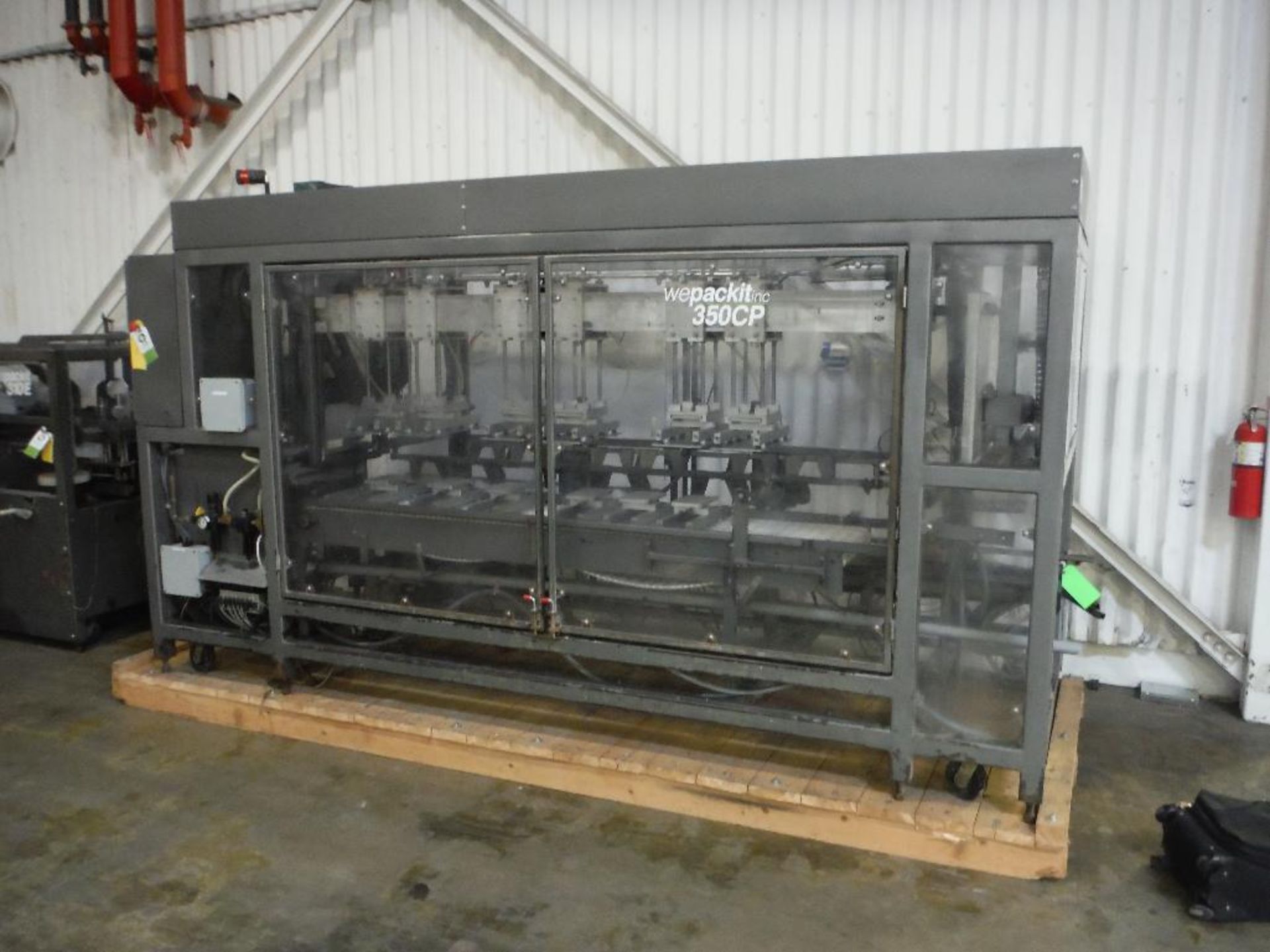 Wepackit case packer, Model 350CP, SN 350CP-2842, 6 twin. heads, 19 in. wide conveyor, carbon steel