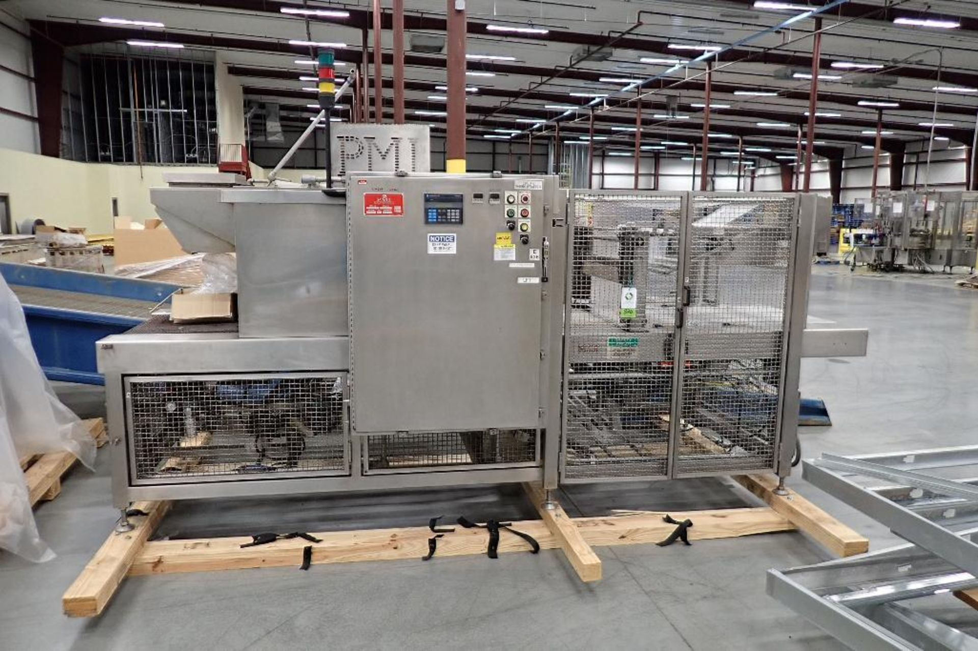 PMI over wrapper, model SI-TW30, s/n 02498, up to 24 in. wide rolls. - ** Located in Buckner, Kentuc