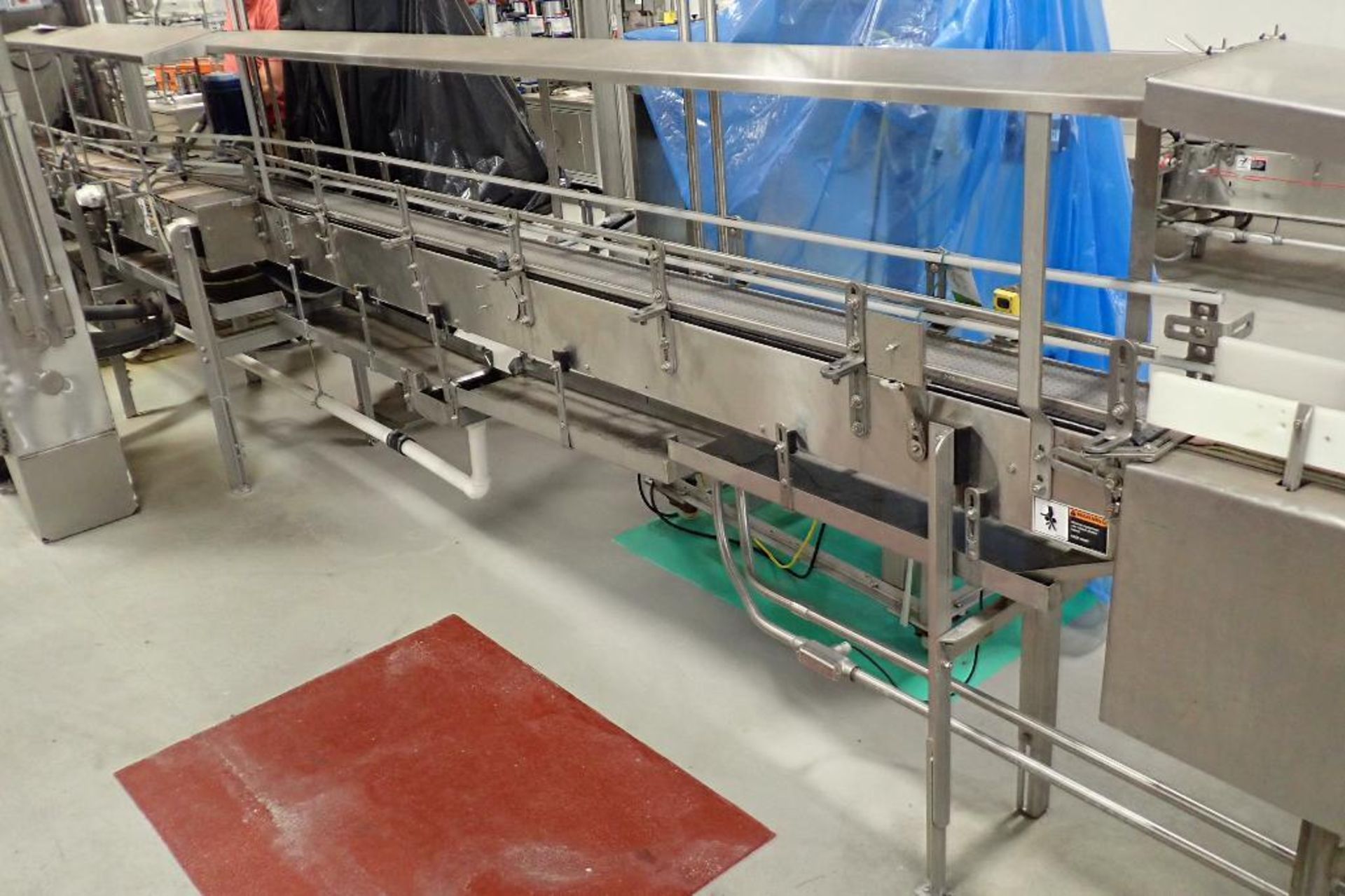 SS bottle conveyor out of rinser, 168 in. long x 7.5 in. wide x 40 in. tall, gray plastic chain belt