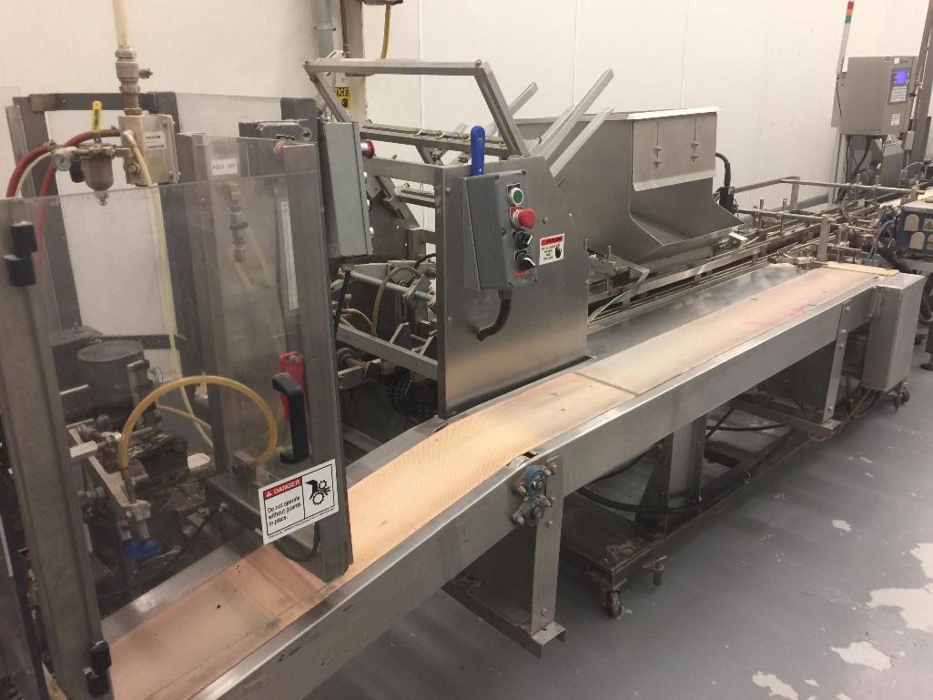 Nordale SS carton erector/sealer, hand load boxes from side, Nordson hot glue. - ** Located in Medin